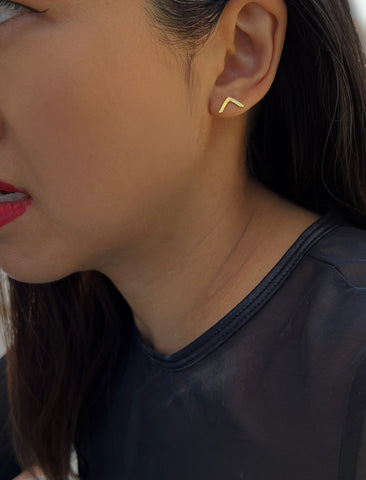 Image Title Female model wearing small modern geometric minimalist simple 2-way convertible TRILL dainty wishbone diamond front back ear jacket stud earrings in 18K gold vermeil with 925 sterling silver base by Sonia Hou, a celebrity AAPI Chinese demi-fine fashion costume jewelry designer