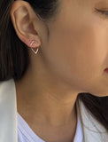 Female model wearing small modern geometric minimalist simple 2-way convertible TRILL dainty wishbone diamond front back ear jacket stud earrings in 18K rose gold vermeil with 925 sterling silver base by Sonia Hou, a celebrity AAPI Chinese demi-fine fashion costume jewelry designer