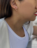 Female model wearing small modern geometric minimalist simple 2-way convertible TRILL dainty wishbone diamond front back ear jacket stud earrings in 18K rose gold vermeil with 925 sterling silver base by Sonia Hou, a celebrity AAPI Chinese demi-fine fashion costume jewelry designer