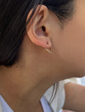Image Title Female model wearing small modern geometric minimalist simple 2-way convertible TRILL dainty wishbone diamond front back ear jacket stud earrings in 18K rose gold vermeil with 925 sterling silver base by Sonia Hou, a celebrity AAPI Chinese demi-fine fashion costume jewelry designer