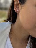 Image Title Female model wearing small modern geometric minimalist simple 2-way convertible TRILL dainty wishbone diamond front back ear jacket stud earrings in 18K rose gold vermeil with 925 sterling silver base by Sonia Hou, a celebrity AAPI Chinese demi-fine fashion costume jewelry designer