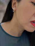Image Title Female model wearing small modern geometric minimalist simple 2-way convertible TRILL dainty wishbone diamond front back ear jacket stud earrings in 925 sterling silver by Sonia Hou, a celebrity AAPI Chinese demi-fine fashion costume jewelry designer