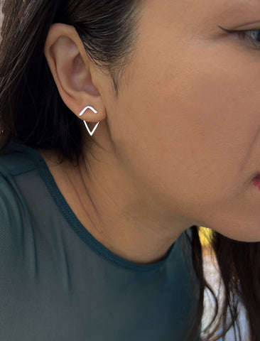 Image Title Female model wearing small modern geometric minimalist simple 2-way convertible TRILL dainty wishbone diamond front back ear jacket stud earrings in 925 sterling silver by Sonia Hou, a celebrity AAPI Chinese demi-fine fashion costume jewelry designer