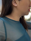 Female model wearing small modern geometric minimalist simple 2-way convertible TRILL dainty wishbone diamond front back ear jacket stud earrings in 925 sterling silver by Sonia Hou, a celebrity AAPI Chinese demi-fine fashion costume jewelry designer