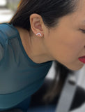 Image Title Female model wearing small modern geometric minimalist simple 2-way convertible TRILL dainty wishbone diamond front back ear jacket stud earrings in 925 sterling silver by Sonia Hou, a celebrity AAPI Chinese demi-fine fashion costume jewelry designer
