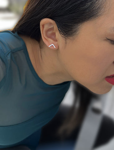 Image Title Female model wearing small modern geometric minimalist simple 2-way convertible TRILL dainty wishbone diamond front back ear jacket stud earrings in 925 sterling silver by Sonia Hou, a celebrity AAPI Chinese demi-fine fashion costume jewelry designer