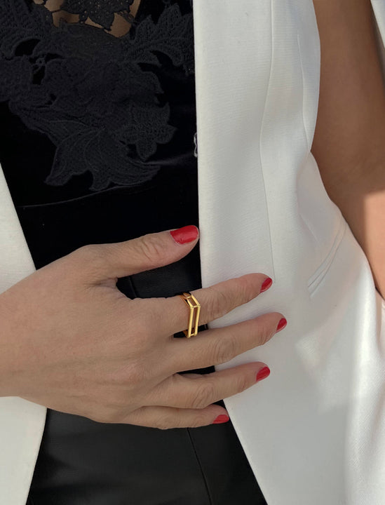 Female model wearing C.E.O. BOLD THICK GEOMETRIC RECTANGULAR RING IN 18K GOLD VERMEIL OVER STERLING SILVER BY SONIA HOU JEWELRY