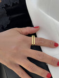 Image Title Female model wearing C.E.O. BOLD THICK GEOMETRIC RECTANGULAR RING IN 18K GOLD VERMEIL OVER STERLING SILVER BY SONIA HOU JEWELRY