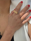 FEMALE MODEL WEARING C.E.O. BOLD THICK GEOMETRIC RECTANGULAR STATEMENT RING IN 18K GOLD VERMEIL OVER STERLING SILVER BY SONIA HOU JEWELRY