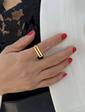 FEMALE MODEL WEARING C.E.O. BOLD THICK GEOMETRIC RECTANGULAR STATEMENT RING IN 18K GOLD VERMEIL OVER STERLING SILVER BY SONIA HOU JEWELRY