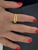 FEMALE MODEL WEARING C.E.O. BOLD THICK GEOMETRIC RECTANGULAR STATEMENT RING IN 18K GOLD VERMEIL OVER STERLING SILVER BY SONIA HOU JEWELRY