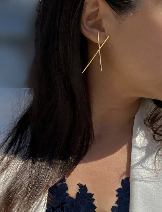 Female Model wearing Asian Inspired Chopsticks Minimalist Long Thin Dangle Earrings in 18K Gold Vermeil With Sterling Silver base by Sonia Hou, a celebrity AAPI demi-fine jewelry designer