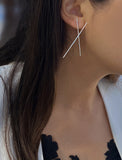 Female model wearing Asian Inspired Chopsticks Minimalist Long Thin Dangle Earrings in Sterling Silver by Sonia Hou, a celebrity AAPI demi-fine jewelry designer