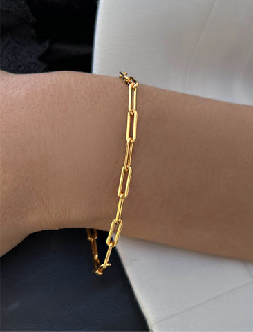 Image Title Female Model wearing Essential Minimalist Bold Thick Chunky Link Chain Paperclip Layering Stacking Statement Rectangular Bracelet in 18K Gold Vermeil With Sterling Silver base by Sonia Hou, a celebrity Chinese AAPI demi-fine jewelry designer