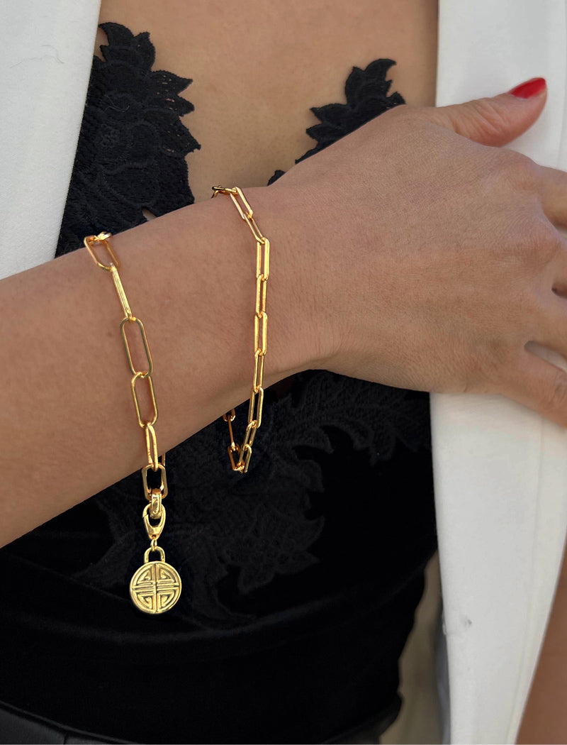 Image Title Female model wearing Asian Inspired Minimalist 2 Way Convertible Lucky Charm Coin Four Blessings Pendant With A Paperclip Link Chain Statement Bold Thick Chunky Layering Stacking Rectangular Bracelet in 18K Gold Vermeil With Sterling Silver base by Sonia Hou, a celebrity AAPI Chinese demi-fine jewelry designer