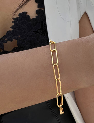 Image Title Female Model wearing Essential Minimalist Large Bold Thick Chunky Link Chain Paperclip Layering Stacking Statement Bracelet in 18K Gold Vermeil With Sterling Silver base by Sonia Hou, a celebrity Chinese AAPI demi-fine jewelry designer