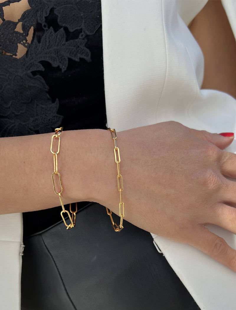 Image Title Female model wearing Asian Inspired Minimalist 2 Way Convertible Lucky Charm Coin Four Blessings Pendant With A Paperclip Link Chain Statement Bold Thick Chunky Layering Stacking Rectangular Bracelet in 18K Gold Vermeil With Sterling Silver base by Sonia Hou, a celebrity AAPI Chinese demi-fine jewelry designer