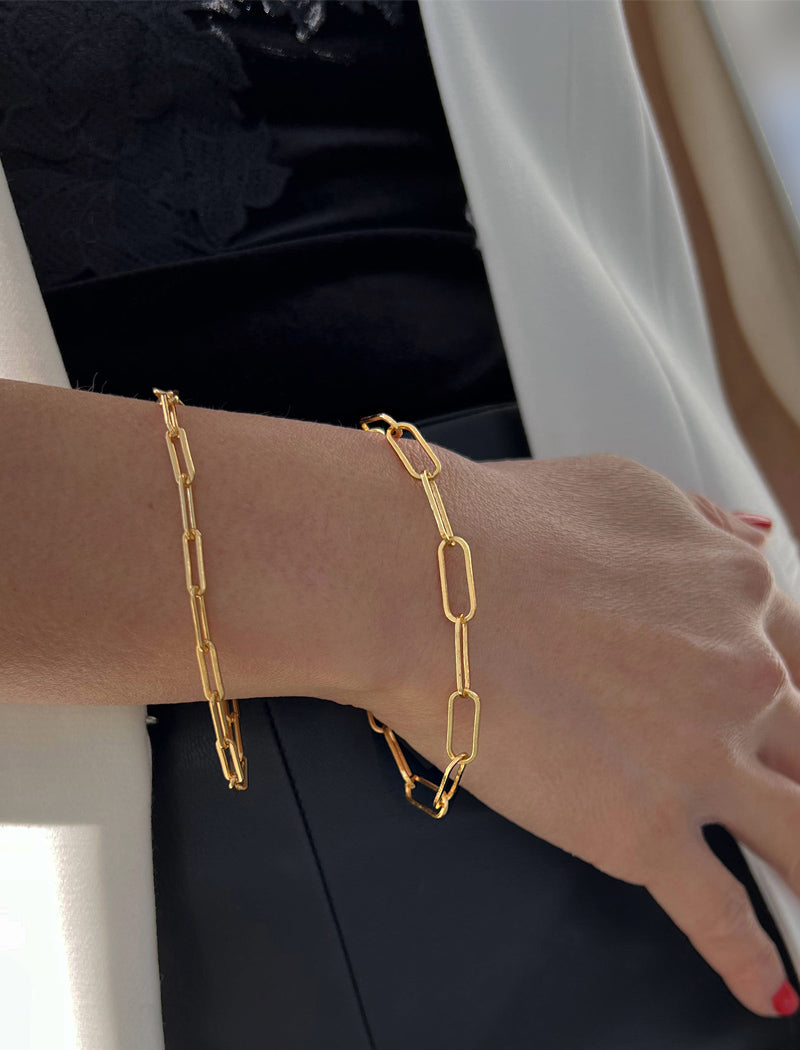 Image Title Female model wearing Asian Inspired Minimalist 2 Way Convertible Lucky Charm Coin Four Blessings Pendant With A Paperclip Link Chain Statement Bold Thick Chunky Layering Stacking Rectangular Bracelet in 18K Gold Vermeil With Sterling Silver base by Sonia Hou, a celebrity AAPI Chinese demi-fine jewelry designer