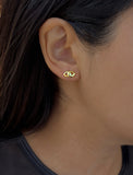 Female model wearing tiny dainty small minimalist inclusive Evil Eye Stud Earrings, inspired by Greek culture, in 18K Gold Vermeil With Sterling Silver base by Sonia Hou, a celebrity AAPI Chinese demi-fine fashion costume jewelry designer