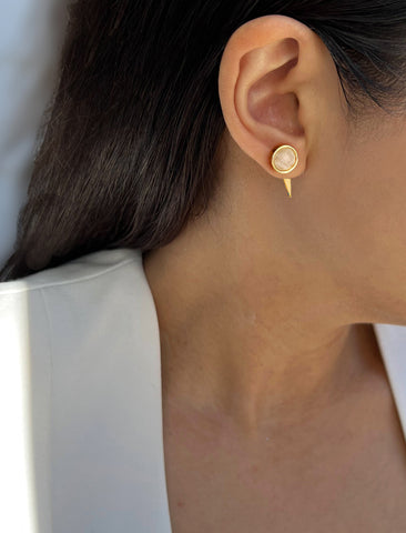 Image Title Woman model wearing luxe minimalist small or big FIRE 3-Way Convertible Geometric White Quartz Gemstone Round Stud Triangle Spike Earring Jackets in 24K Gold by Sonia Hou, a celebrity AAPI Chinese demi-fine fashion costume jewelry designer. Actress Jessica Alba wore these similar modern spike ear jackets.