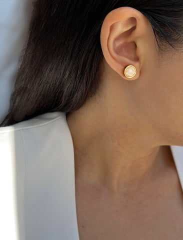 Image Title Female model wearing luxe minimalist small or big FIRE 3-Way Convertible White Quartz Gemstone Round Stud earrings in 24K Gold by Sonia Hou, a celebrity AAPI Asian Chinese demi-fine fashion costume jewelry designer.