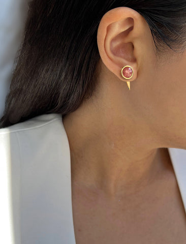 Image Title Woman model wearing luxe minimalist small or big FIRE 3-Way Convertible Geometric Pink Coral Gemstone Round Stud Triangle Spike Earring Jackets in 24K Gold by Sonia Hou, a celebrity AAPI Chinese demi-fine fashion costume jewelry designer. Actress Jessica Alba wore these similar modern spike ear jackets.