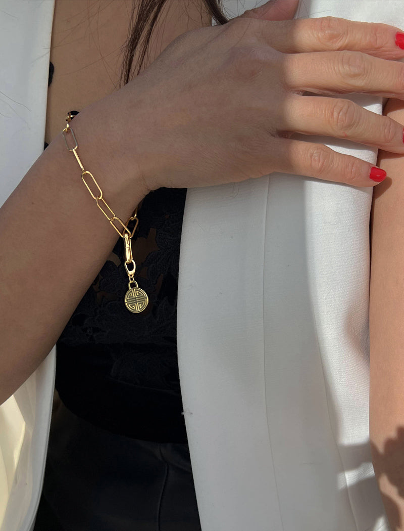 Image Title Female model wearing Asian Inspired Minimalist 2 Way Convertible Lucky Charm Coin Four Blessings Pendant With A Paperclip Link Chain Statement Bold Thick Chunky Layering Stacking Rectangular Bracelet in 18K Gold Vermeil With Sterling Silver base by Sonia Hou, a celebrity AAPI Chinese demi-fine jewelry designer