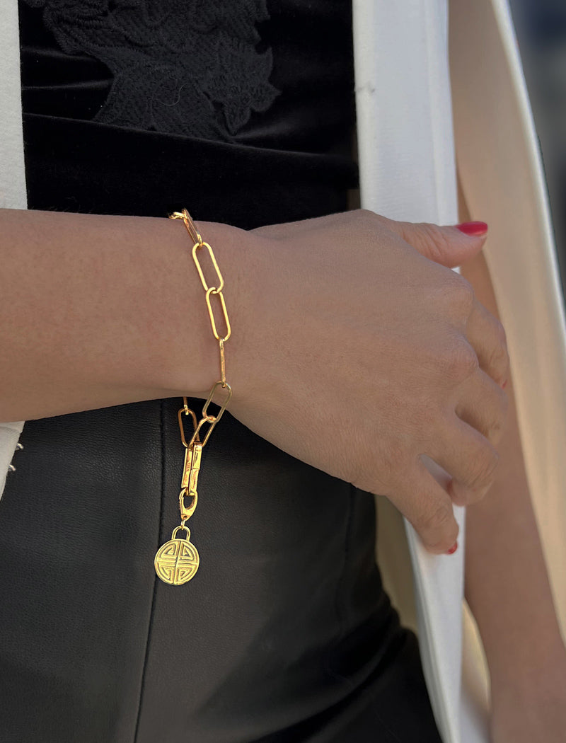 Image Title Female model wearing Asian Inspired Minimalist 2 Way Convertible Lucky Charm Coin Four Blessings Pendant With A Paperclip Link Chain Statement Bold Thick Chunky Layering Stacking Rectangular Bracelet in 18K Gold Vermeil With Sterling Silver base by Sonia Hou, a celebrity AAPI Chinese demi-fine jewelry designer