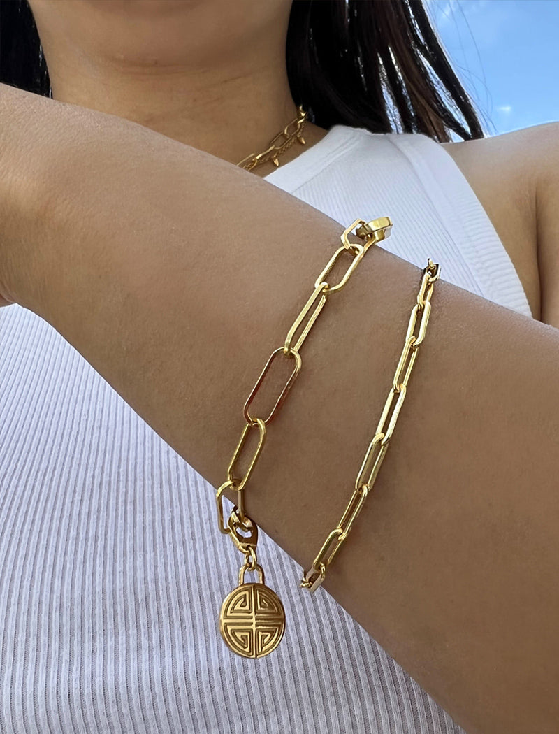 Image Title Female model wearing Asian Inspired Minimalist 2 Way Convertible Lucky Charm Coin Four Blessings Pendant With A Paperclip Link Chain Statement Bold Thick Chunky Layering Stacking Rectangular Bracelet in 18K Gold Vermeil With Sterling Silver base by Sonia Hou, a celebrity AAPI Chinese demi-fine jewelry designer