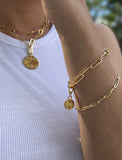 Image Title Female model wearing Asian Inspired Minimalist 2 Way Convertible Lucky Charm Coin Four Blessings Pendant With A Paperclip Link Chain Statement Bold Thick Chunky Layering Stacking Rectangular Bracelet in 18K Gold Vermeil With Sterling Silver base by Sonia Hou, a celebrity AAPI Chinese demi-fine jewelry designer