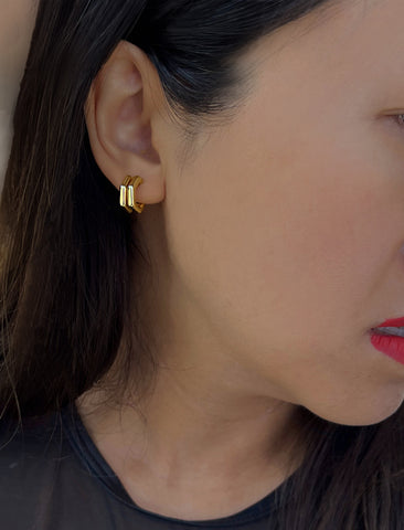 Image Title Female model wearing minimalist small chunky bold thick dainty stacking layering statement round FUTURISTIC Double Hexagon Huggie Hoop Earrings in 18K Gold Vermeil With 925 Sterling Silver base by Sonia Hou, a celebrity AAPI Chinese demi-fine jewelry designer