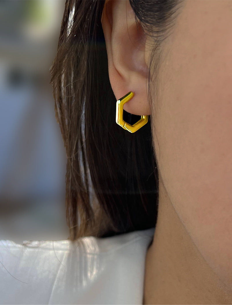 Image Title Female model wearing minimalist mini tiny small chunky bold thick dainty stacking layering statement round INNOVATE Hexagon Huggie Hoop Earrings in 18K Gold Vermeil With 925 Sterling Silver base by Sonia Hou, a celebrity AAPI Chinese demi-fine jewelry designer