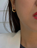 Image Title Female model wearing minimalist mini tiny small chunky bold thick dainty stacking layering statement round INNOVATE Hexagon Huggie Hoop Earrings in 18K Gold Vermeil With 925 Sterling Silver base by Sonia Hou, a celebrity AAPI Chinese demi-fine jewelry designer