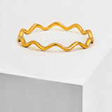 Image Title Asian Inspired Thin Wavy Ramen Noodle Stacking Ring in 18K Gold Vermeil with Sterling Silver base by Sonia Hou, a celebrity AAPI Chinese demi-fine jewelry designer
