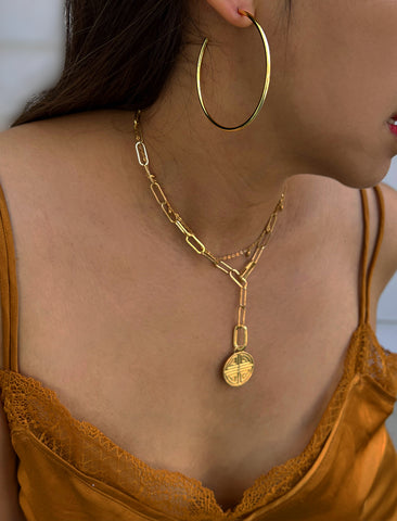 Image Title Female model wearing big medium large thin round circle PERFECT 50mm 2 inch hoop stacking lightweight everyday statement earrings in 18K Gold Vermeil With 925 Sterling Silver base by Sonia Hou, a celebrity AAPI Chinese demi-fine jewelry designer