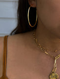 Image Title Female model wearing big medium large thin round circle PERFECT 50mm 2 inch hoop stacking lightweight everyday statement earrings in 18K Gold Vermeil With 925 Sterling Silver base by Sonia Hou, a celebrity AAPI Chinese demi-fine jewelry designer