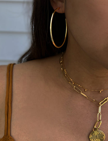 Image Title Female model wearing big medium large thin round circle PERFECT 50mm 2 inch hoop stacking lightweight everyday statement earrings in 18K Gold Vermeil With 925 Sterling Silver base by Sonia Hou, a celebrity AAPI Chinese demi-fine jewelry designer