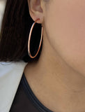 Image Title Female model wearing big medium large thin round circle PERFECT 50mm or 2 inch hoop stacking lightweight everyday statement earrings in 18K rose gold vermeil with a 925 Sterling Silver base by Sonia Hou, a celebrity AAPI Chinese demi-fine jewelry designer