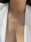 Image Title Female model wearing inclusive Asian inspired thin Rice bead minimalist chain layering stacking necklace in 18K gold vermeil with a 925 sterling silver base by Sonia Hou, a celebrity Chinese AAPI demi-fine jewelry designer