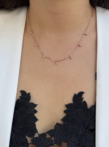 Image Title Female model wearing inclusive Asian Inspired Thin Rice Bead Minimalist Chain Layering Stacking Necklace in 18K Rose Gold Vermeil With Sterling Silver base by Sonia Hou, a celebrity AAPI Chinese demi-fine jewelry designer