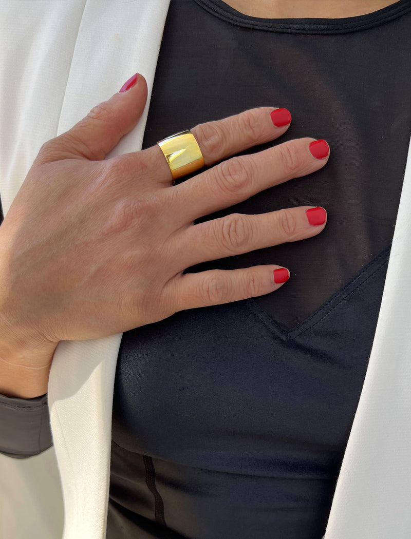 Image Title Female model wearing wide  RICH thick bold chunky statement cigar band ring in 18k gold vermeil with 925 sterling silver base by Sonia Hou, a celebrity AAPI Chinese demi-fine jewelry designer