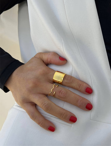 Image Title Female model wearing wide RICH thick bold chunky statement cigar band ring in 18K gold vermeil with a 925 sterling silver base by Sonia Hou, a celebrity AAPI Chinese demi-fine jewelry designer