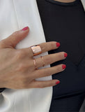 Image Title Female model wearing wide RICH thick bold chunky statement cigar band ring in 18k rose gold vermeil with 925 sterling silver base by Sonia Hou, a celebrity AAPI Chinese demi-fine jewelry designer