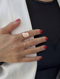 Female model wearing wide  RICH thick bold chunky statement cigar band ring in 18K rose gold vermeil with a 925 sterling silver base by Sonia Hou, a celebrity AAPI Chinese demi-fine jewelry designer