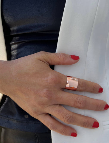 Image Title Female model wearing wide RICH thick bold chunky statement cigar band ring in 18K rose gold vermeil with a 925 sterling silver base by Sonia Hou, a celebrity AAPI Chinese demi-fine jewelry designer