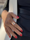 Image Title Female model wearing wide RICH thick bold chunky statement cigar band ring in 18k rose gold vermeil with 925 sterling silver base by Sonia Hou, a celebrity AAPI Chinese demi-fine jewelry designer