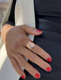 Female model wearing wide RICH thick bold chunky statement cigar band ring in 18K rose gold vermeil with a 925 sterling silver base by Sonia Hou, a celebrity AAPI Chinese demi-fine jewelry designer