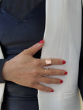 Female model wearing wide RICH thick bold chunky statement cigar band ring in 18k rose gold vermeil with 925 sterling silver base by Sonia Hou, a celebrity AAPI Chinese demi-fine jewelry designer