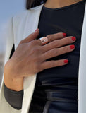 Female model wearing wide RICH thick bold chunky statement cigar band ring in 18k rose gold vermeil with 925 sterling silver base by Sonia Hou, a celebrity AAPI Chinese demi-fine jewelry designer