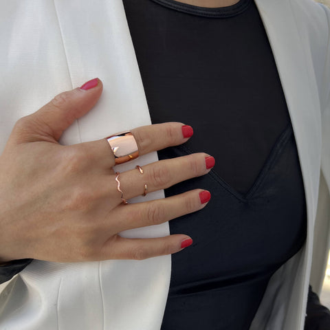 Image Title Female model wearing Asian Inspired Thin Wavy Ramen Noodle Stacking Ring in 18K Rose Gold Vermeil with Sterling Silver base by Sonia Hou, a celebrity AAPI Chinese demi-fine jewelry designer